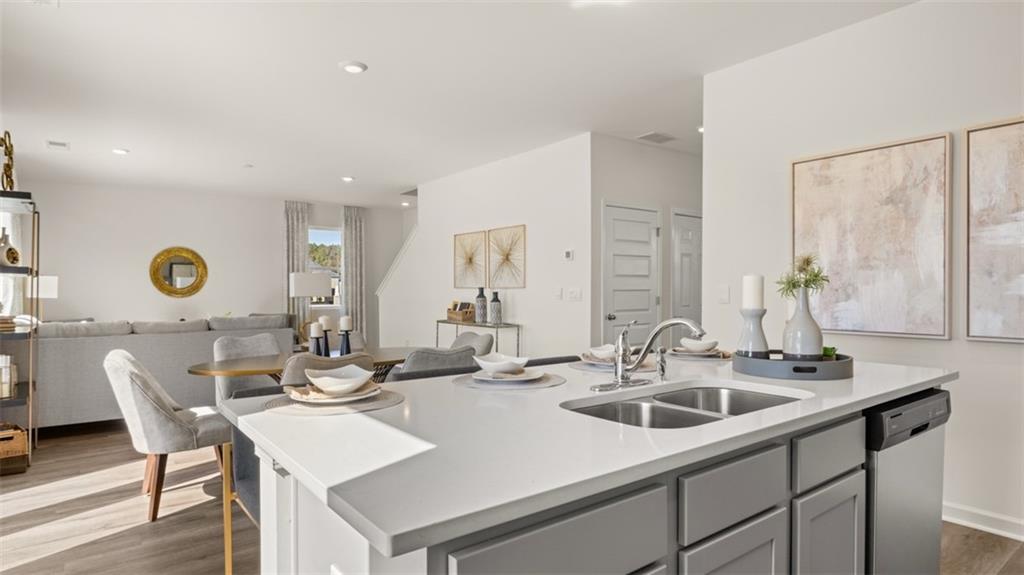 182 Aster Avenue Locust Grove, GA 30248 - Photo 15 of 48 a kitchen with a sink and stove