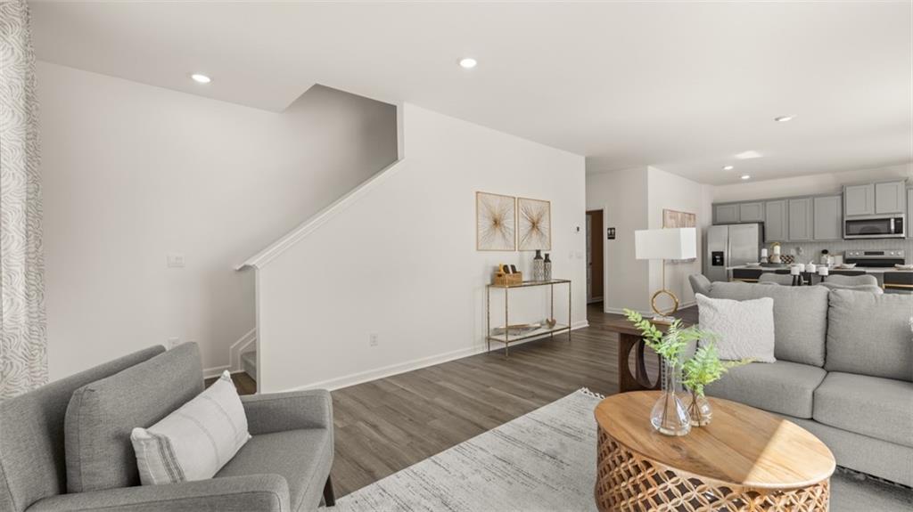 182 Aster Avenue Locust Grove, GA 30248 - Photo 19 of 48 a living room with furniture and kitchen view