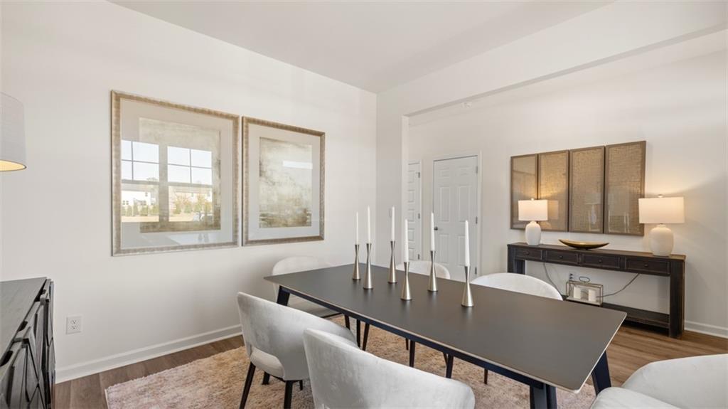 182 Aster Avenue Locust Grove, GA 30248 - Photo 21 of 48 a view of a dining room with furniture and window
