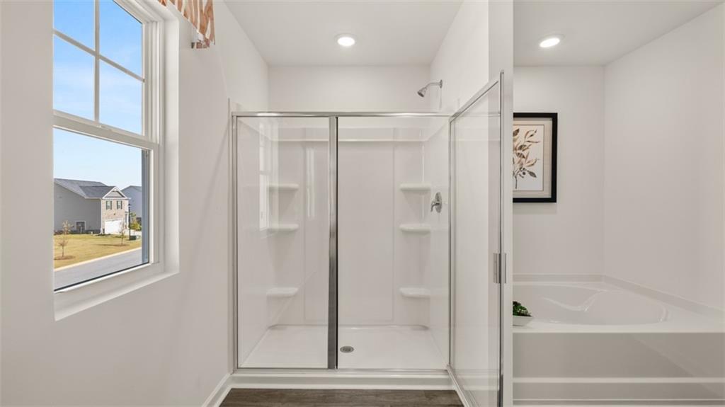 182 Aster Avenue Locust Grove, GA 30248 - Photo 30 of 48 a bathroom with bathtub and shower
