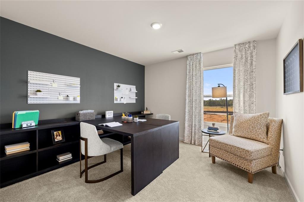 182 Aster Avenue Locust Grove, GA 30248 - Photo 42 of 48 a work room with furniture and a window