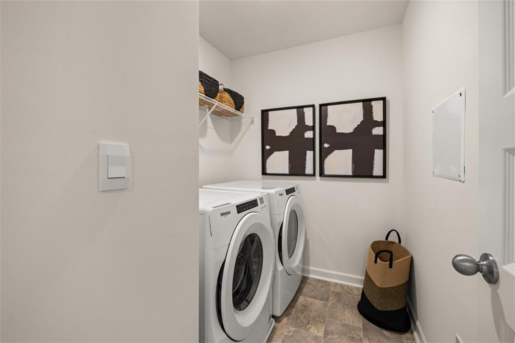 182 Aster Avenue Locust Grove, GA 30248 - Photo 45 of 48 a utility room with dryer and washer