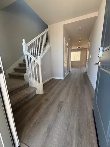 a view of entryway with wooden floor