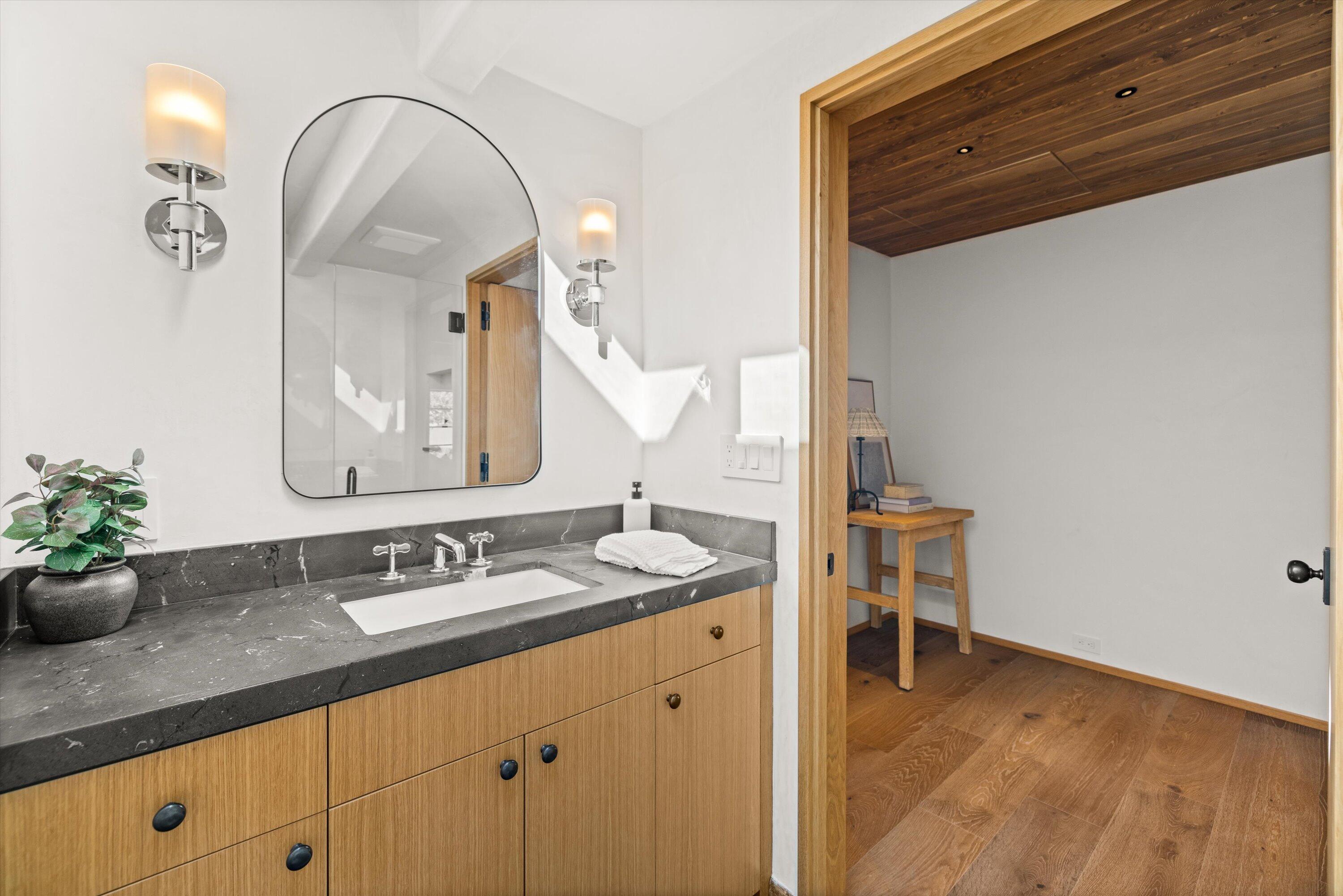 734 El Rancho Road Montecito, CA 93108 - Photo 15 of 24 a bathroom with a sink and a mirror