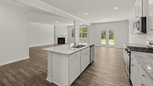 a view of a room with wooden floor and window