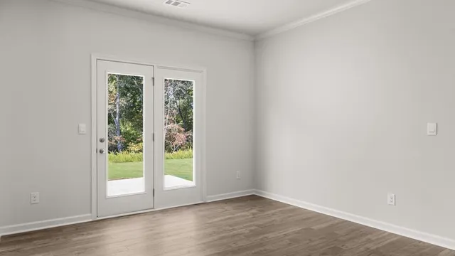 a view of a kitchen with a sink and a refrigerator