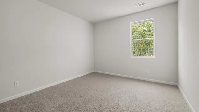 a bathroom with a granite countertop sink toilet mirror and bathtub