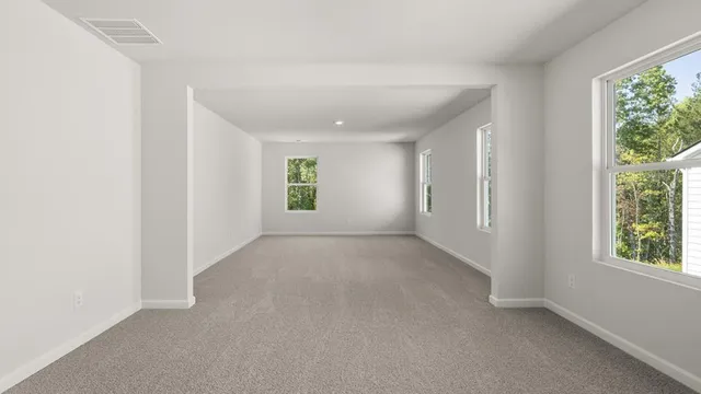 a bathroom with a granite countertop tub a sink and a window