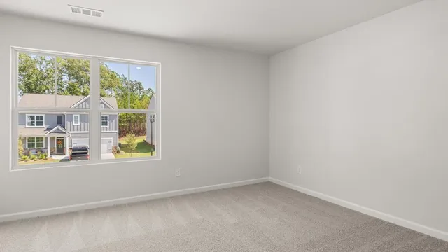 an aerial view of a house with a big yard