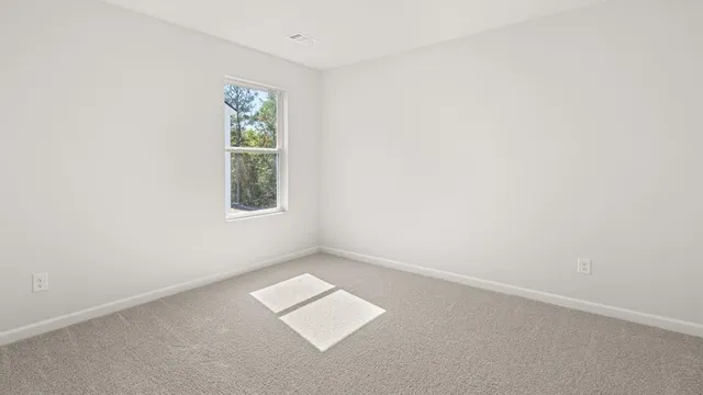 an aerial view of a house with a big yard