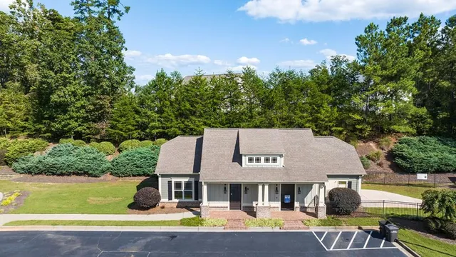 a view of a lake in middle of the forest