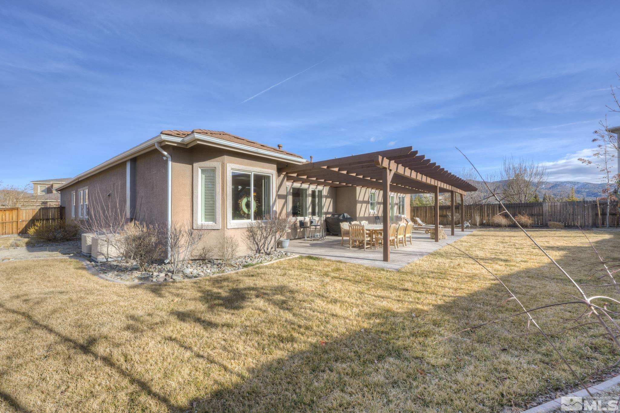 10585 Dillingham Drive Reno, NV 89521 - Photo 35 of 39 a big house with a big yard and large trees