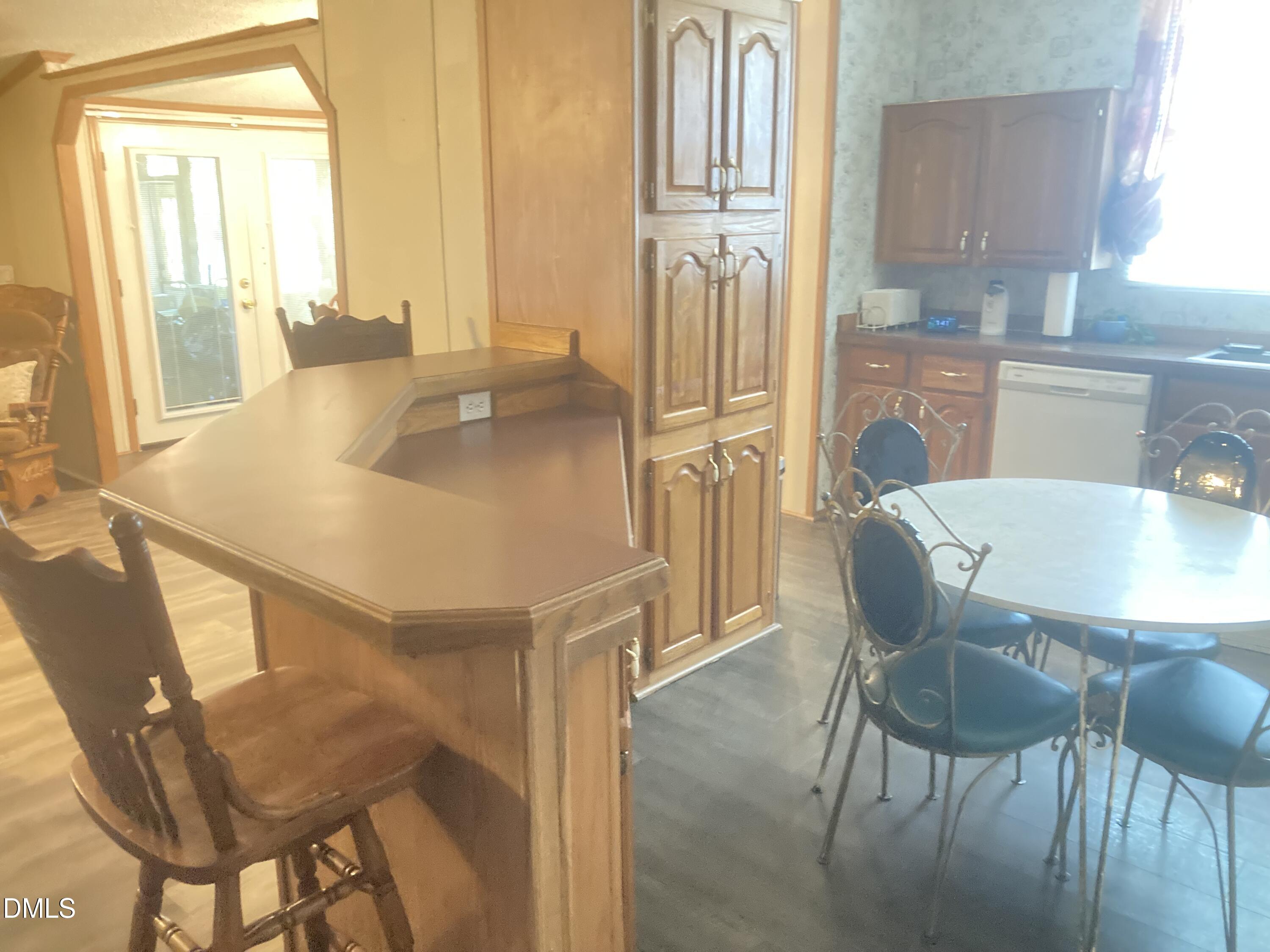 1586 Gum Swamp Church Road Greenville, NC 27834 - Photo 35 of 93 a view of a dining room with furniture and a window