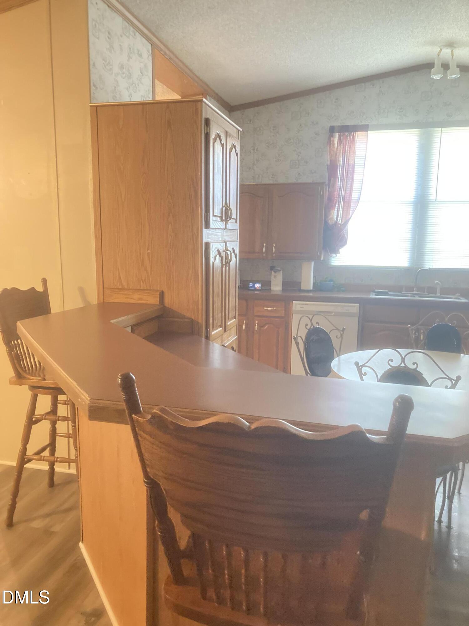 1586 Gum Swamp Church Road Greenville, NC 27834 - Photo 36 of 93 a kitchen with a table chairs and a window