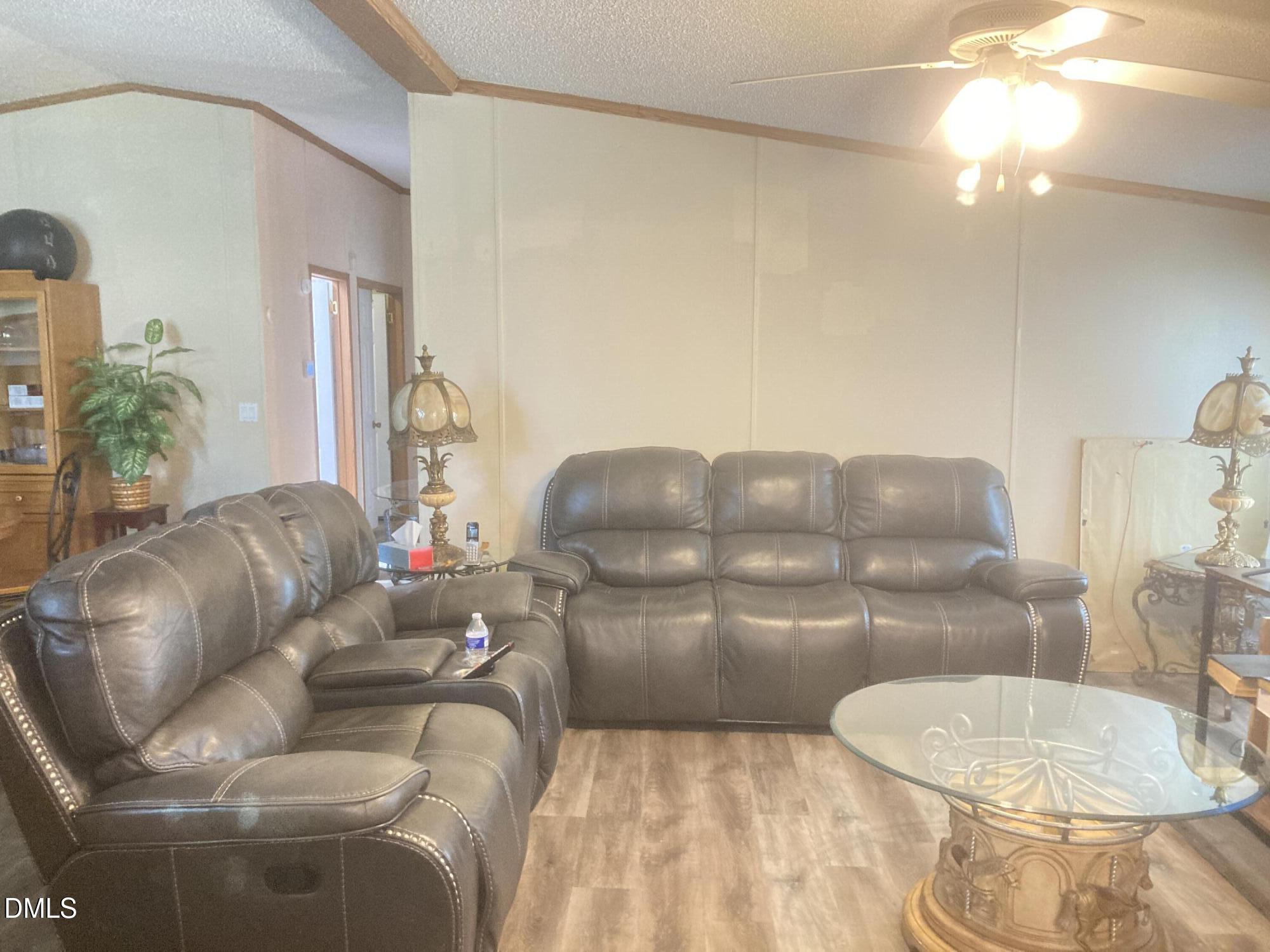 1586 Gum Swamp Church Road Greenville, NC 27834 - Photo 40 of 93 a living room with furniture and a wooden floor