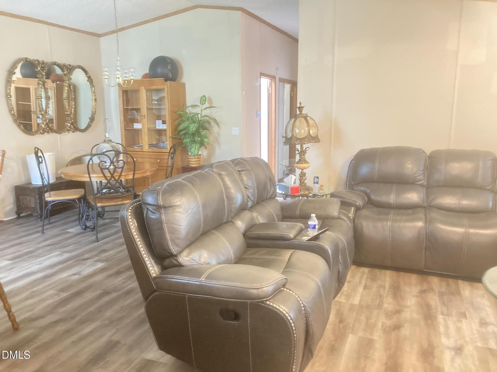 1586 Gum Swamp Church Road Greenville, NC 27834 - Photo 41 of 93 a living room with furniture and wooden floor
