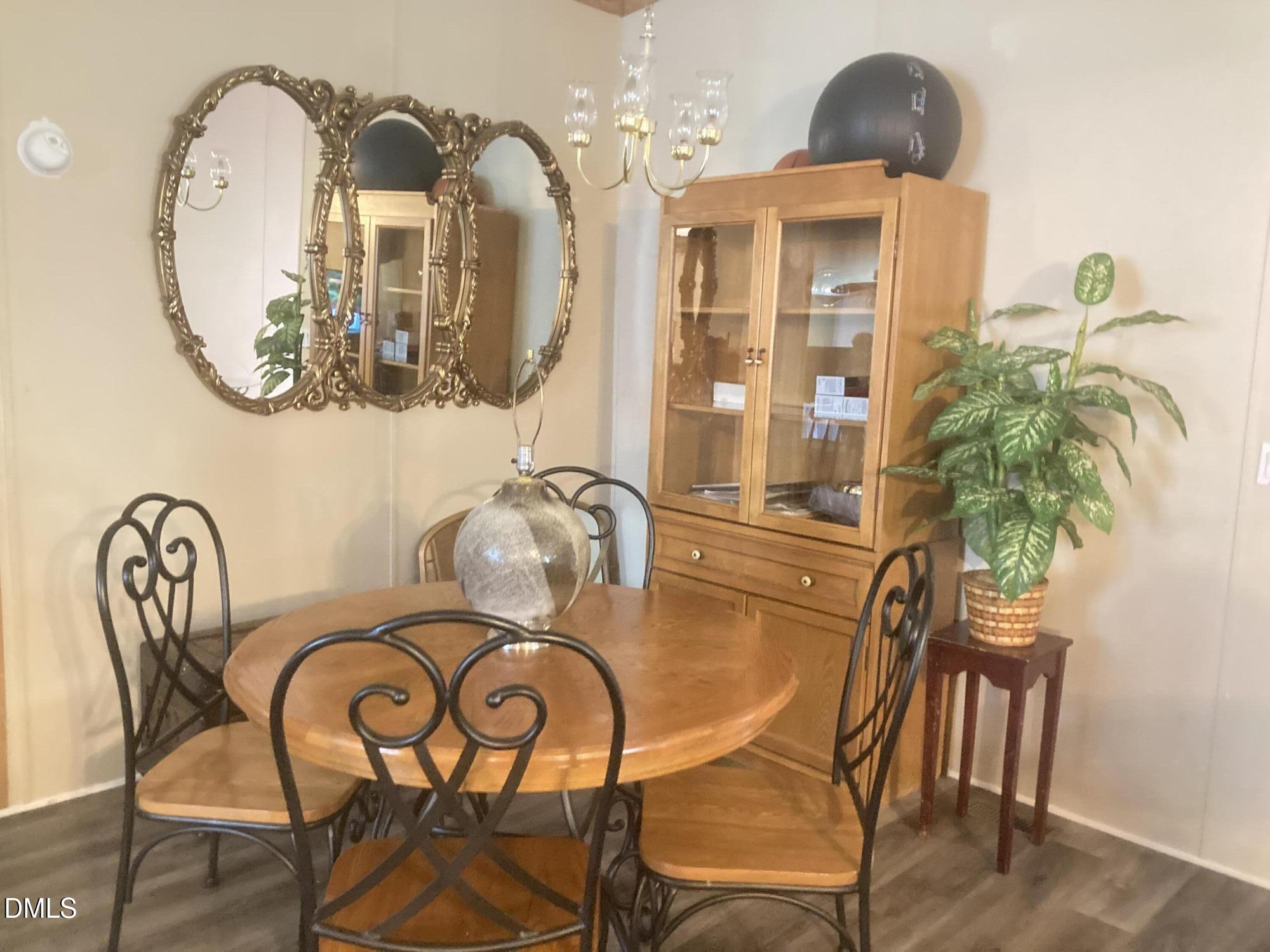 1586 Gum Swamp Church Road Greenville, NC 27834 - Photo 44 of 93 a view of a dining room with furniture and wooden floor