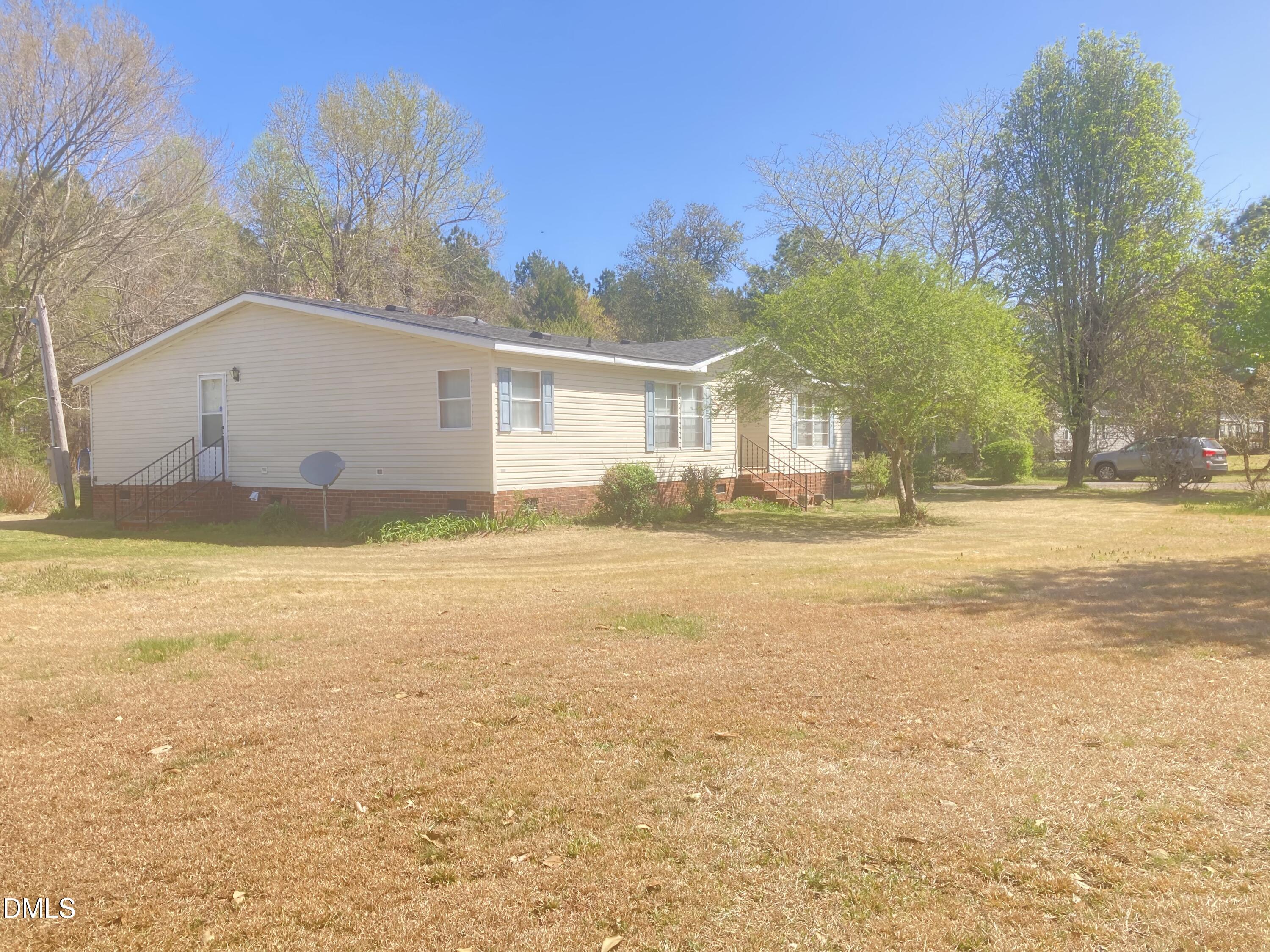 1586 Gum Swamp Church Road Greenville, NC 27834 - Photo 3 of 93 a view of a house with a yard and a large tree