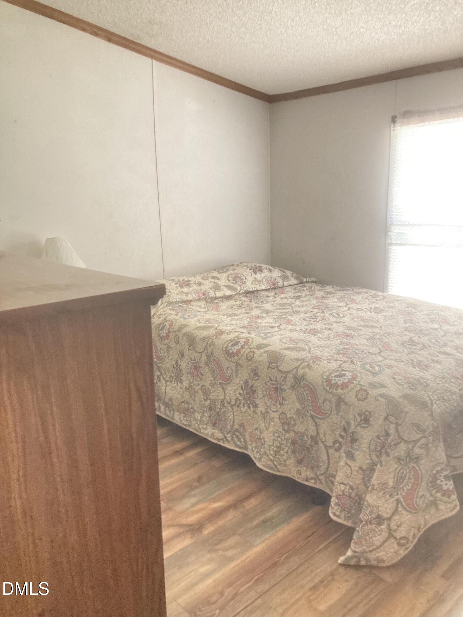 1586 Gum Swamp Church Road Greenville, NC 27834 - Photo 55 of 93 a bedroom with a bed and a window