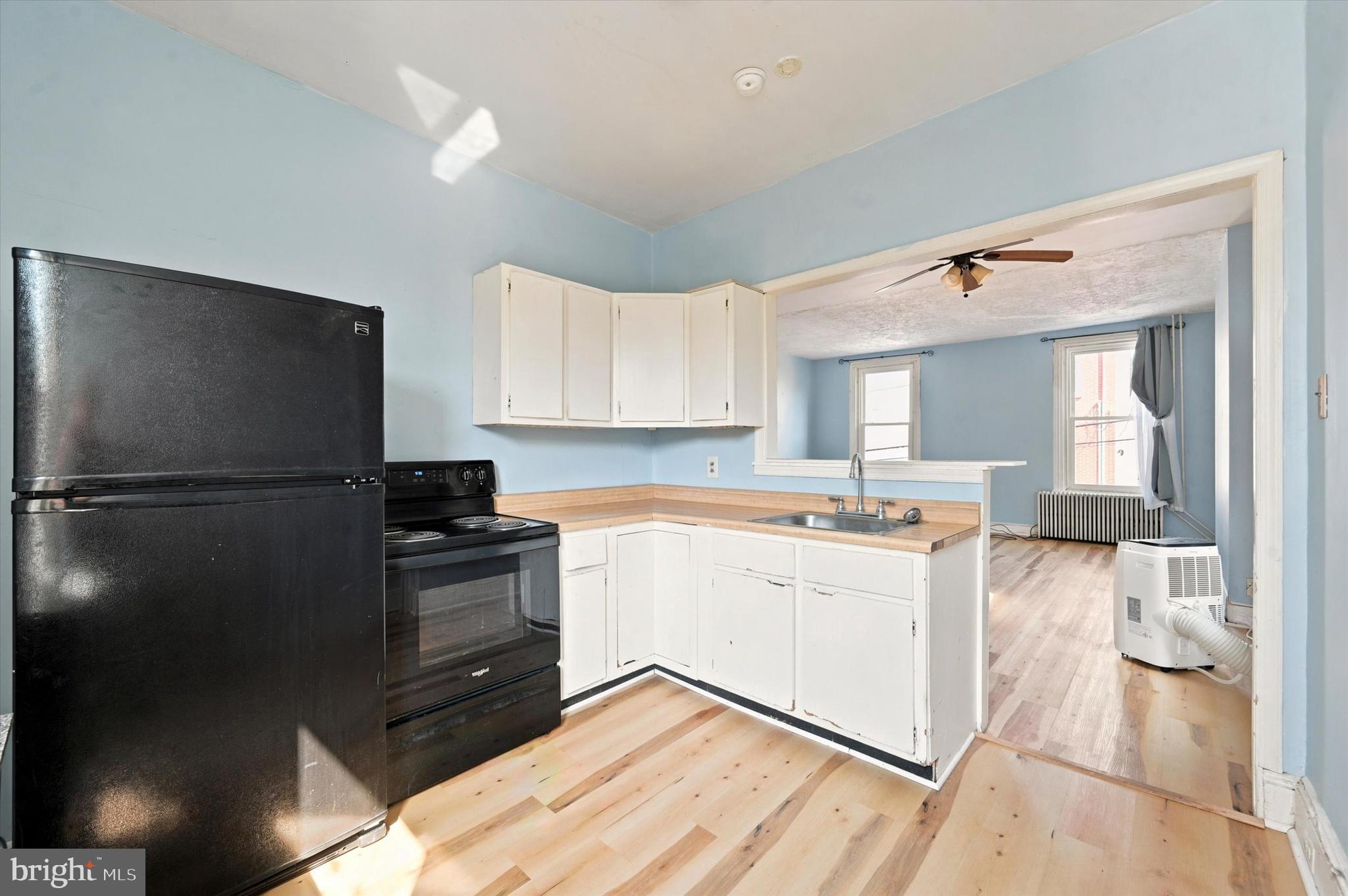 204 Ripka Street, Unit 2 Philadelphia, PA 19127 - Photo 6 of 22 a kitchen with a refrigerator and a sink