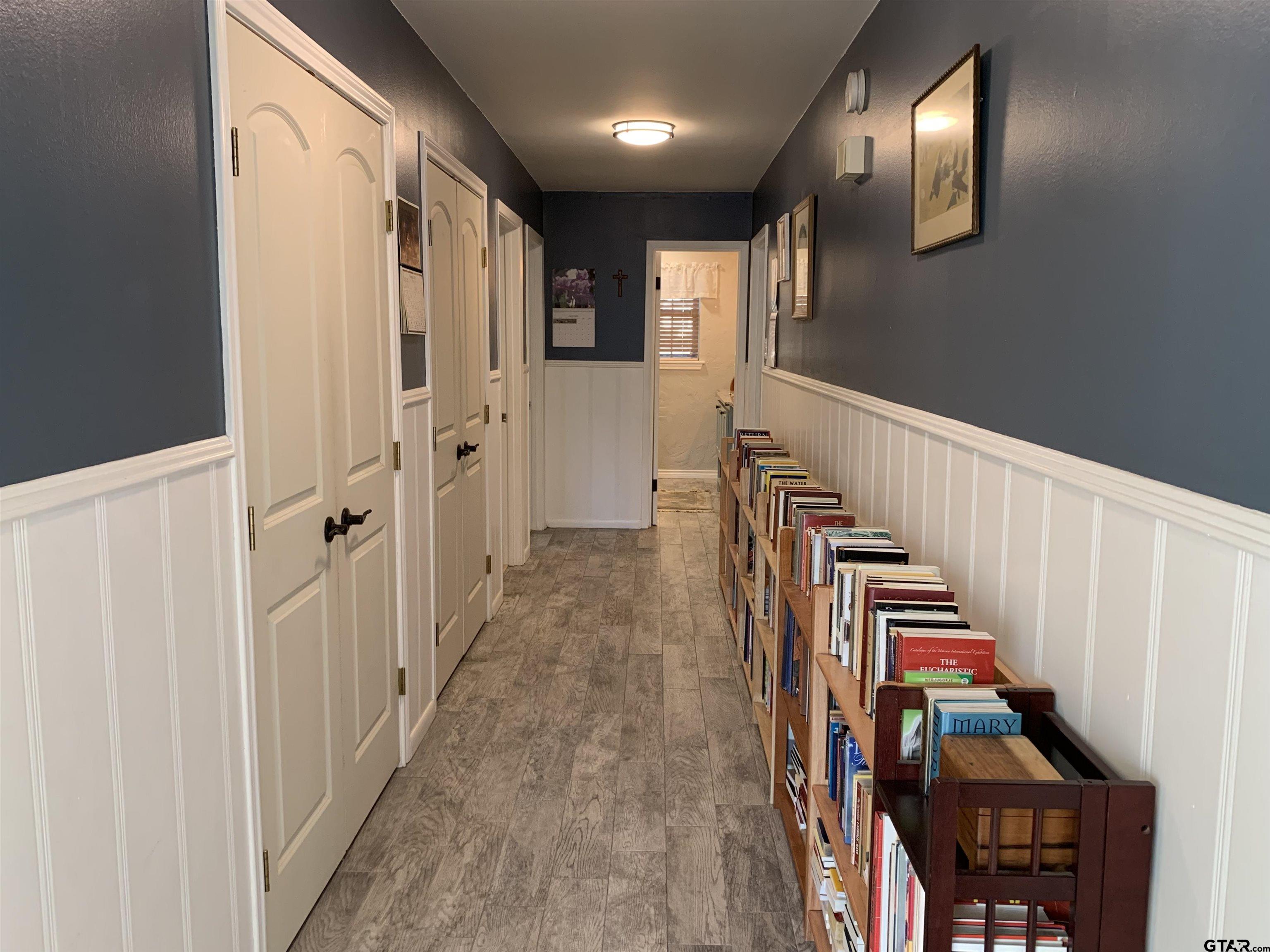 800 Neches Drive Tyler, TX 75702 - Photo 22 of 26 a view of a hallway with wooden floor and staircase