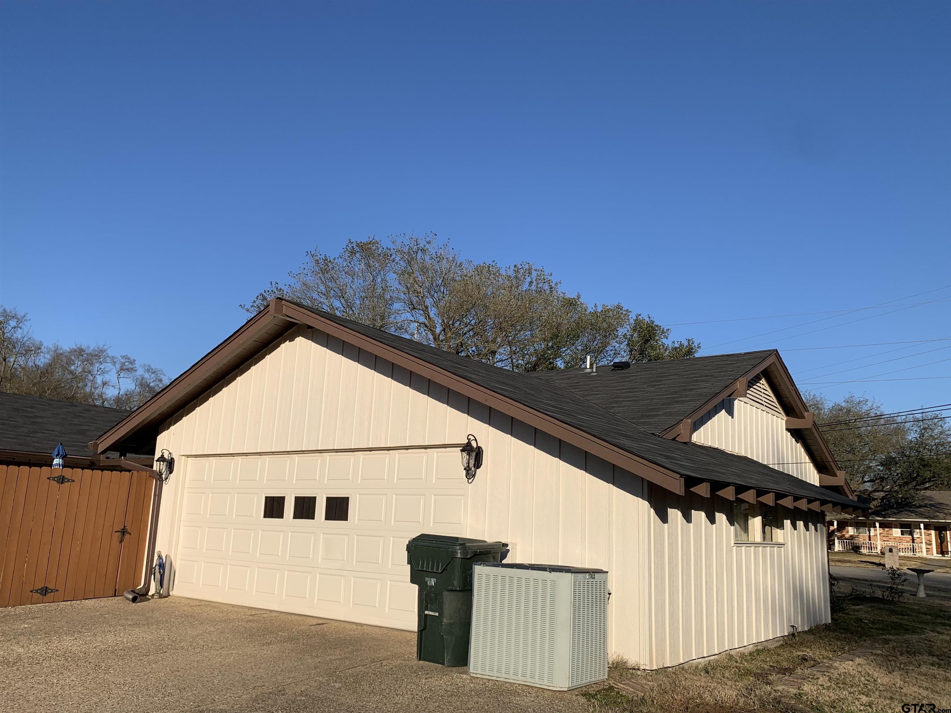 800 Neches Drive Tyler, TX 75702 - Photo 24 of 26 a view of a house with a street