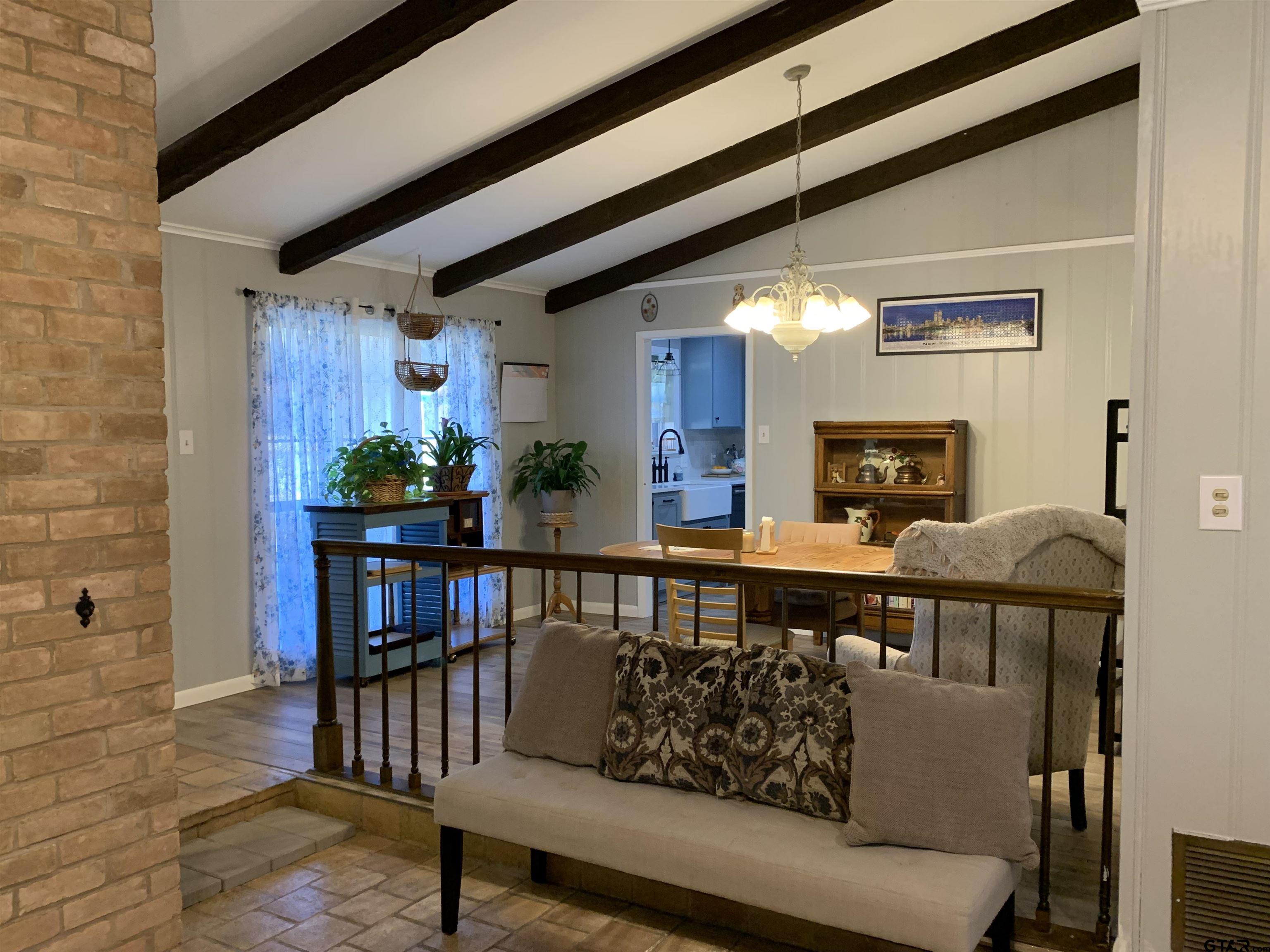 800 Neches Drive Tyler, TX 75702 - Photo 6 of 26 a living room with furniture and a fireplace