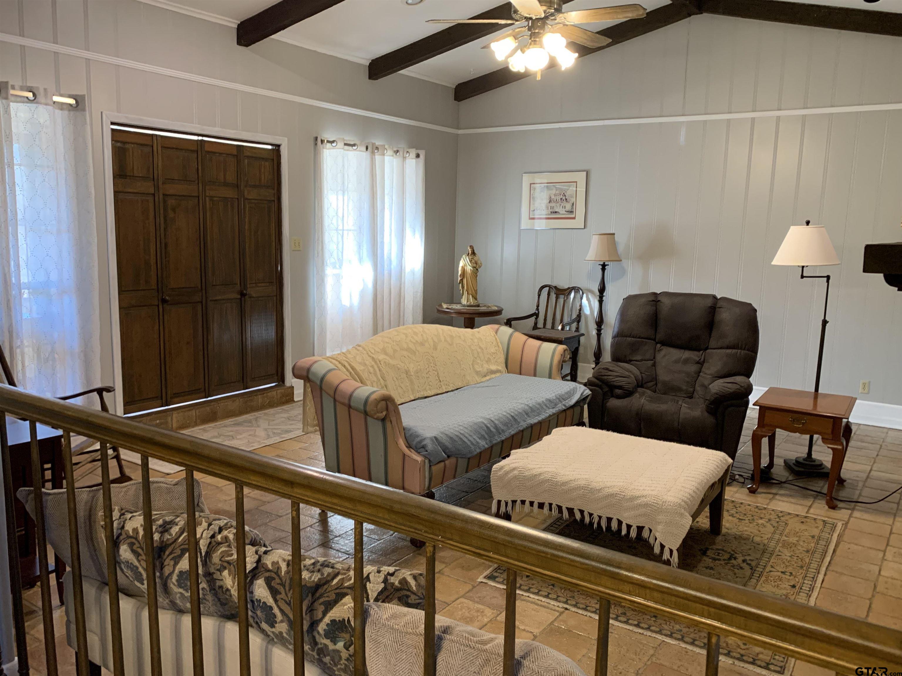 800 Neches Drive Tyler, TX 75702 - Photo 8 of 26 a view of a livingroom with furniture and staircase