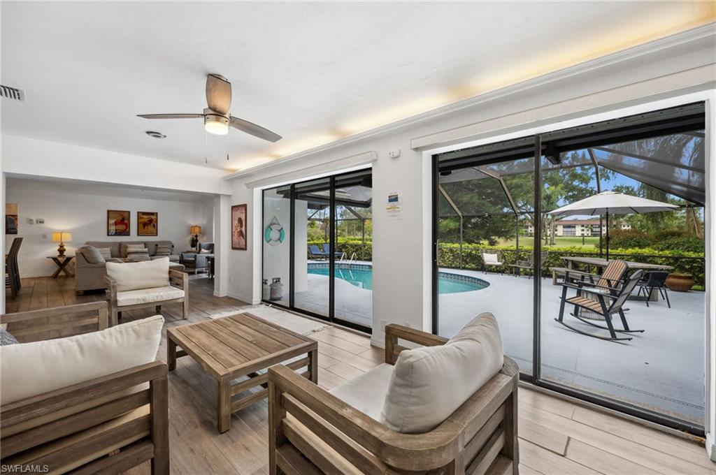 118 Palmetto Dunes Circle Naples, FL 34113 - Photo 18 of 31 Florida room to pool area