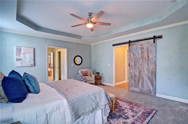 a bathroom with a granite countertop toilet a sink and a mirror