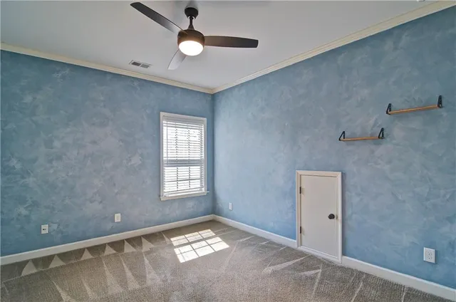 a view of a hallway with wooden floor and closet area