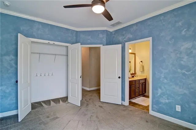 a white toilet and tub sitting next to a bathroom sink