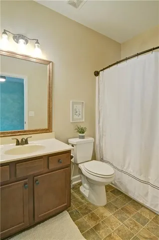 a view of a double sink and a mirror