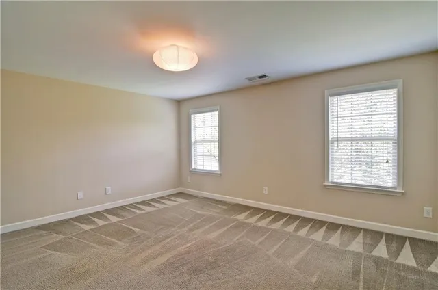 a bathroom with a shower and a sink