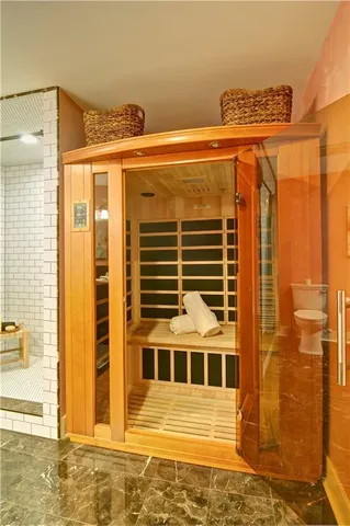 a view of a balcony with wooden floor and fence