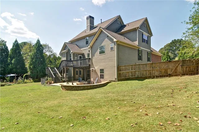 a backyard of a house with outdoor seating