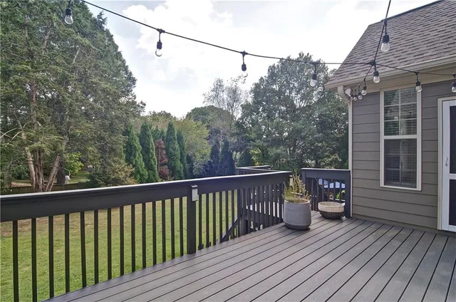 a backyard of a house with yard and outdoor seating