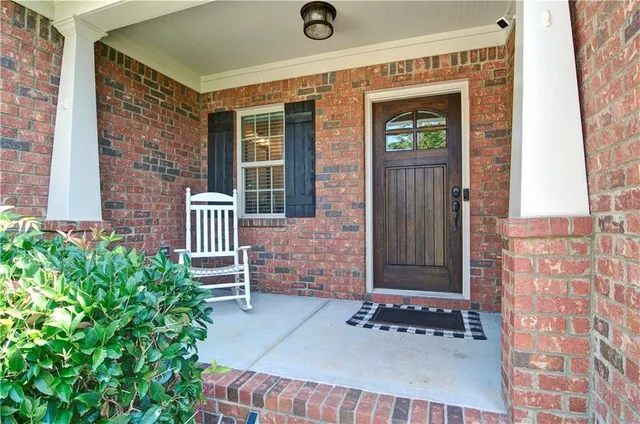 a kitchen with stainless steel appliances granite countertop a sink refrigerator and cabinets