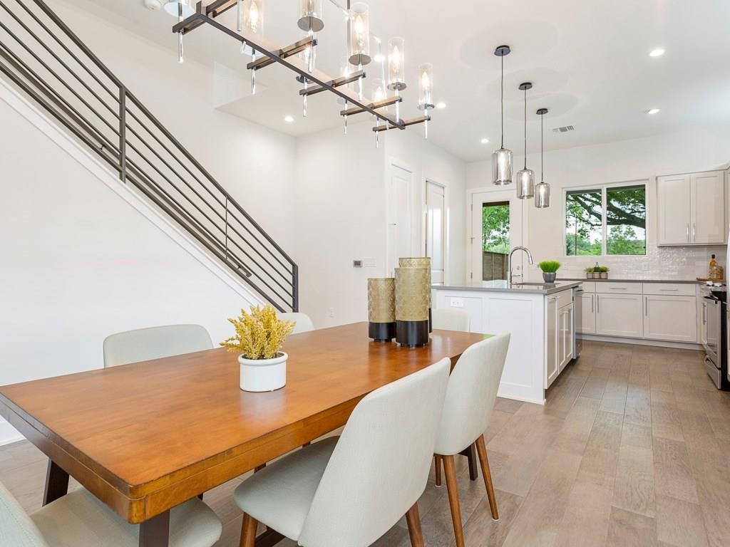 1111 Brookswood Avenue, Unit A Austin, TX 78721 - Photo 8 of 21 Dining area looking toward kitchen, laundry door far left and exit to backyard