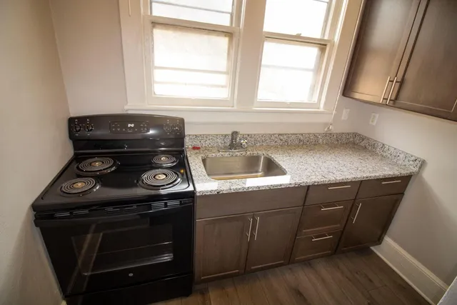 a kitchen with a stove and a sink