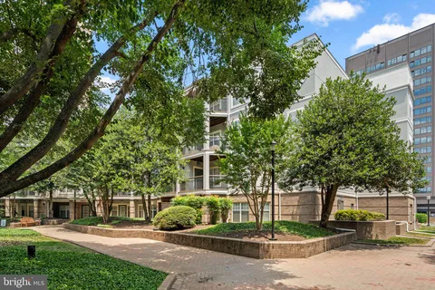 a view of a building with a yard