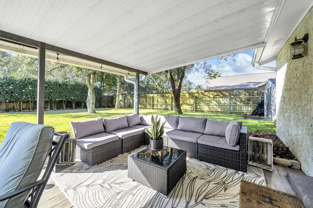 a view of swimming pool with outdoor seating and city view