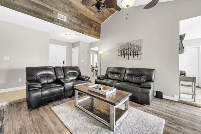 a living room with furniture a couch and a fireplace