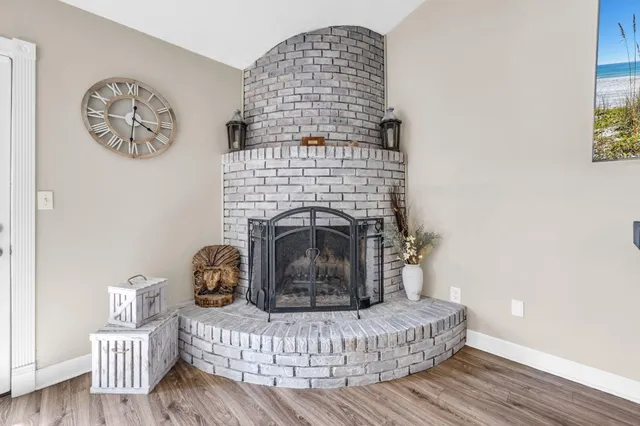 a kitchen with stainless steel appliances granite countertop a refrigerator a stove a sink and a microwave