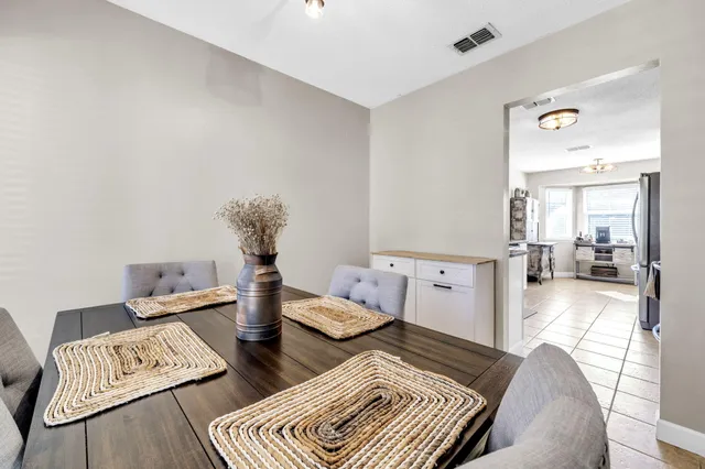 a bedroom with a bed and a ceiling fan