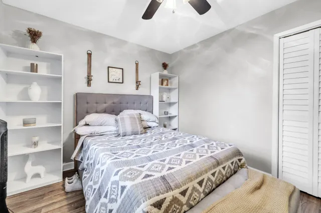 a view of a bedroom with furniture and windows