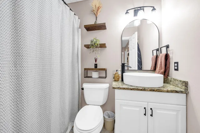 a view of a room with a window and wooden floor