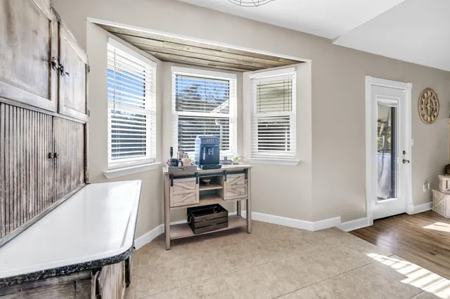 a view of backyard with wooden fence