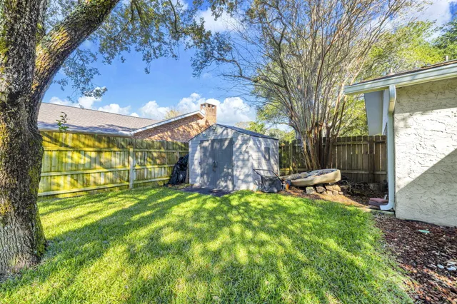 a house view with swimming pool in front of the house