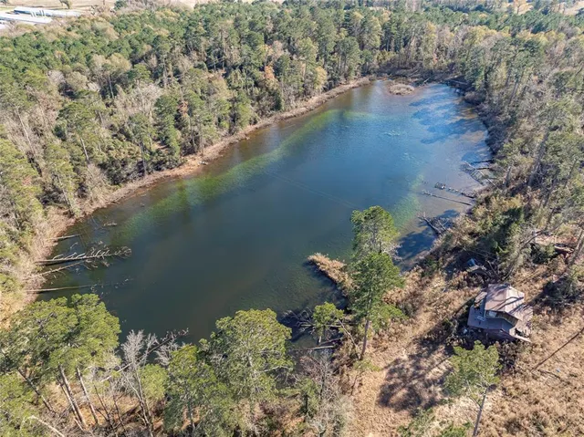 a view of a lake with a yard